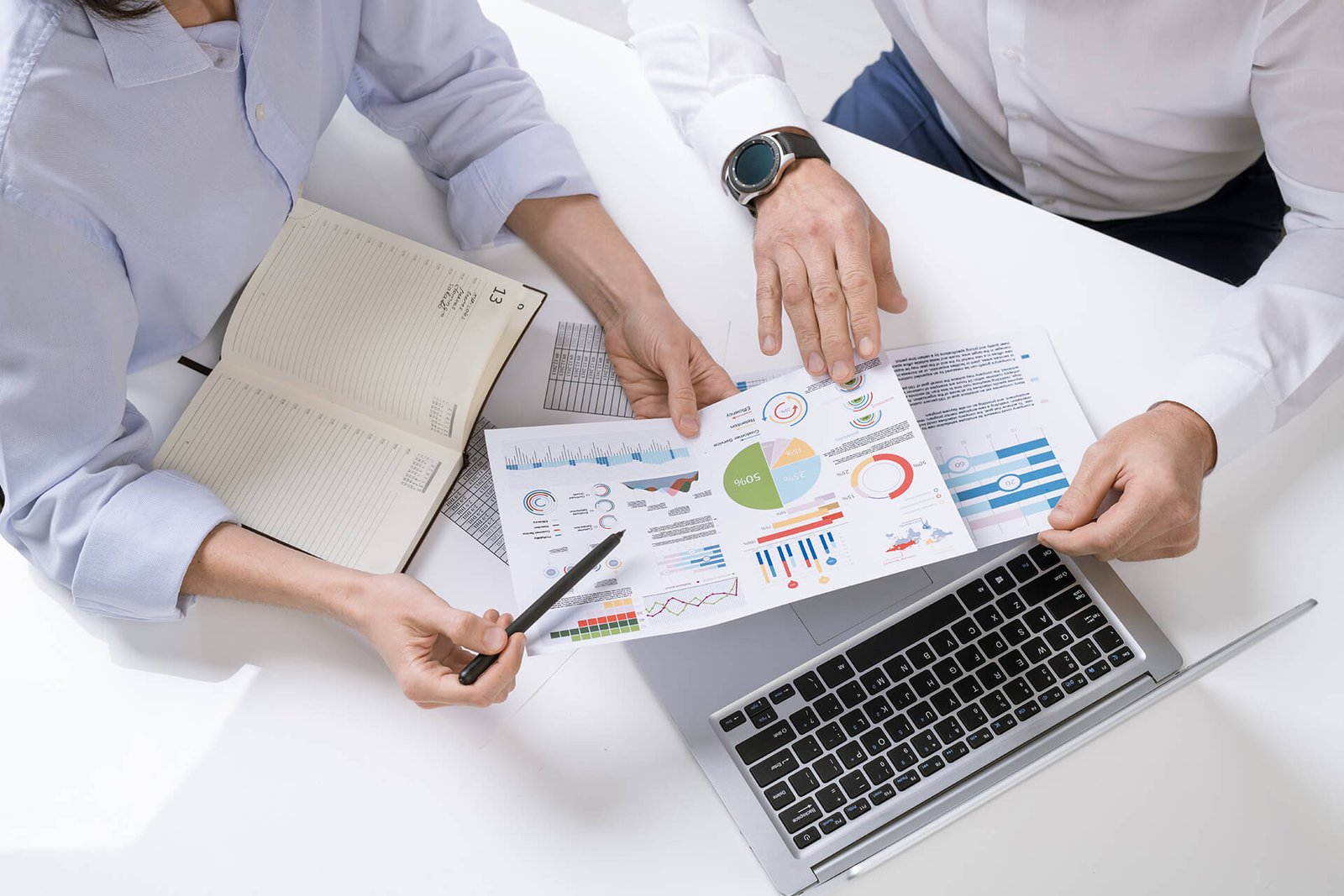 Vinay Associates advisors reviewing financial documents